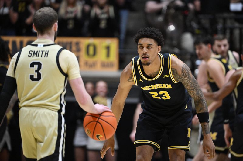 Feb 17, 2026; West Lafayette, Indiana, USA; Michigan Wolverines forward Yaxel Lendeborg (23) defends against Purdue Boilermakers guard Braden Smith (3) during the first half at Mackey Arena. Mandatory Credit: Marc Lebryk-Imagn Images