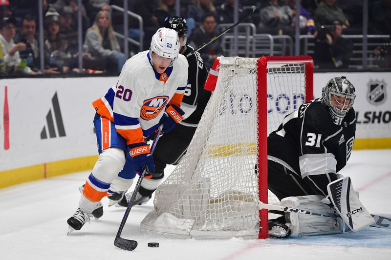 Mar 11, 2024; Los Angeles, California, USA; /New York Islanders right wing Hudson Fasching (20) moves in for a shot against Los Angeles Kings defenseman Andreas Englund (5) and goaltender David Rittich (31) during the first period at Crypto.com Arena. Mandatory Credit: Gary A. Vasquez-USA TODAY Sports