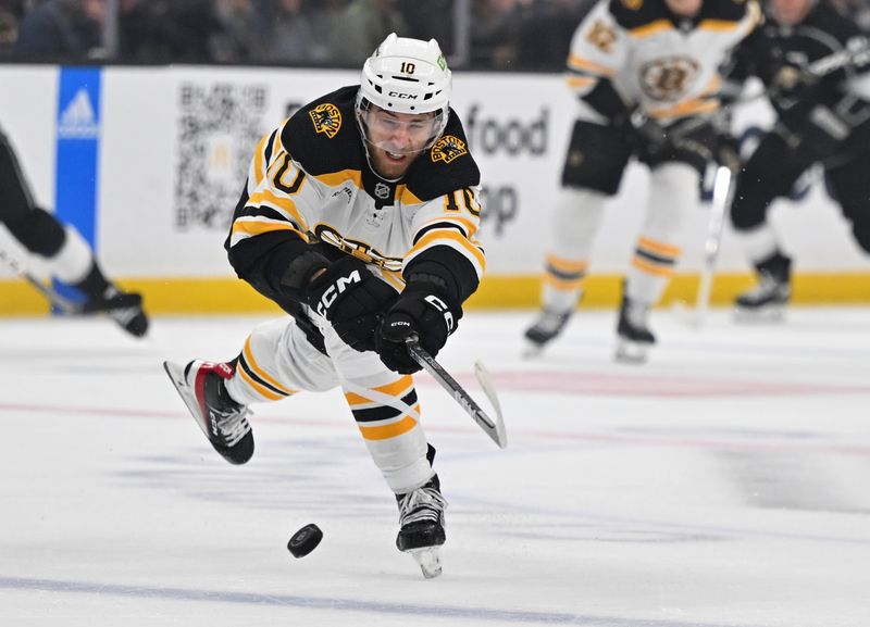 Jan 5, 2023; Los Angeles, California, USA;  Boston Bruins left wing A.J. Greer (10) chases down the puck in the first period against the Los Angeles Kings at Crypto.com Arena. Mandatory Credit: Jayne Kamin-Oncea-USA TODAY Sports