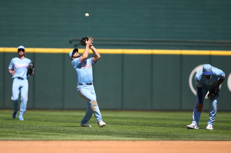 Sep 8, 2024; Arlington, Texas, USA; Texas Rangers shortstop Josh Smith (8) catches a pop fly in the third inning against the Los Angeles Angels at Globe Life Field. Mandatory Credit: Tim Heitman-Imagn Images