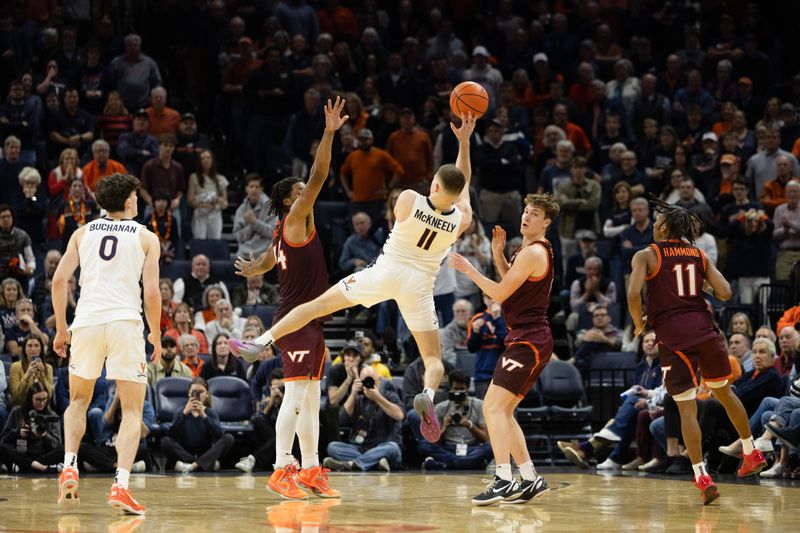 Feb 1, 2025; Charlottesville, Virginia, USA; Virginia Cavaliers guard Isaac McKneely (11) shoots the ball as Virginia Tech Hokies forward Mylyjael Poteat (34) defends in the second half at John Paul Jones Arena. Mandatory Credit: Emily Morgan-Imagn Images