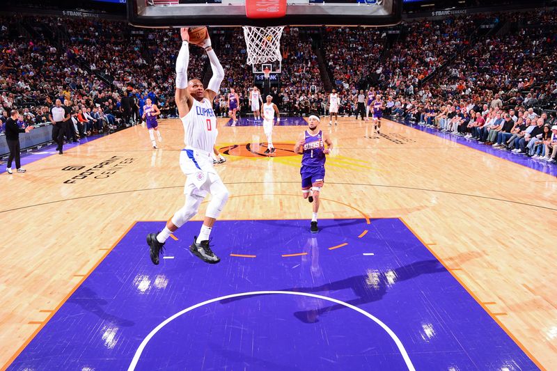 PHOENIX, AZ - APRIL  9: Russell Westbrook #0 of the LA Clippers drives to the basket during the game against the Phoenix Suns on April 9, 2024 at Footprint Center in Phoenix, Arizona. NOTE TO USER: User expressly acknowledges and agrees that, by downloading and or using this photograph, user is consenting to the terms and conditions of the Getty Images License Agreement. Mandatory Copyright Notice: Copyright 2024 NBAE (Photo by Kate Frese/NBAE via Getty Images)