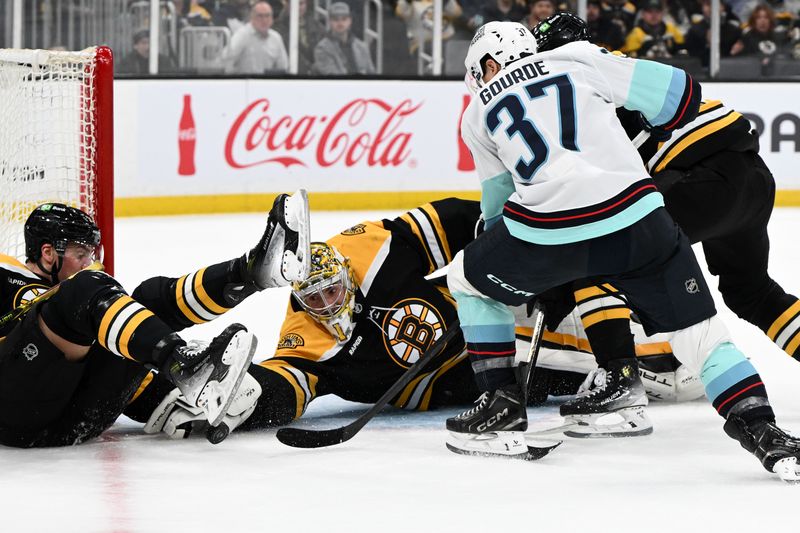 Nov 3, 2024; Boston, Massachusetts, USA; Boston Bruins goaltender Jeremy Swayman (1) makes a save on a shot made by Seattle Kraken center Yanni Gourde (37) during the second period at the TD Garden. Mandatory Credit: Brian Fluharty-Imagn Images