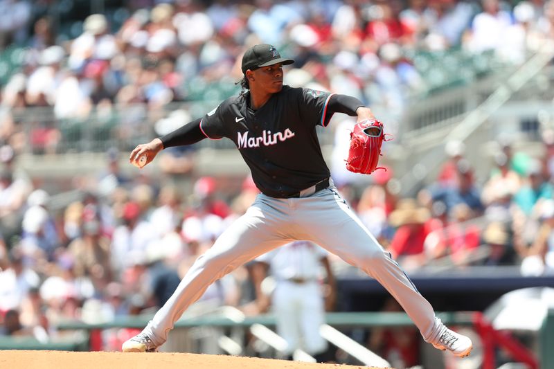 Aug 4, 2024; Cumberland, Georgia, USA; Miami Marlins starting pitcher Edward Cabrera (27) pitches against the Atlanta Braves in the first inning at Truist Park. Mandatory Credit: Mady Mertens-USA TODAY Sports