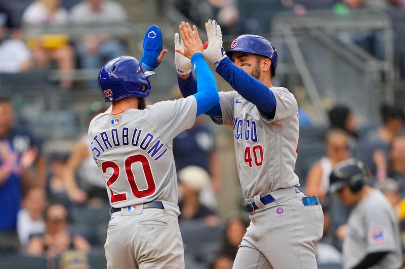 Jul 8, 2023; Bronx, New York, USA; Chicago Cugs third baseman Miles Mastrobuoni (20) congratulates designated hitter Mike Tauchman (40) for hitting a two run home run against the New York Yankees during the eighth inning at Yankee Stadium. Mandatory Credit: Gregory Fisher-USA TODAY Sports