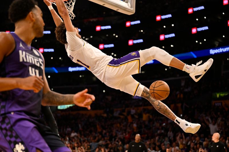 LOS ANGELES, CALIFORNIA - OCTOBER 26: Jaxson Hayes #11 of the Los Angeles Lakers dunks the ball while Trey Lyles #41 of the Sacramento Kings looks on in the second half at Crypto.com Arena on October 26, 2024 in Los Angeles, California. NOTE TO USER: User expressly acknowledges and agrees that, by downloading and or using this photograph, User is consenting to the terms and conditions of the Getty Images License Agreement. (Photo by John McCoy/Getty Images)