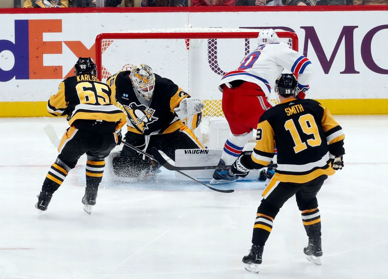 Nov 22, 2023; Pittsburgh, Pennsylvania, USA; Pittsburgh Penguins goaltender Tristan Jarry (35) makes a save against New York Rangers left wing Chris Kreider (20) during the third period at PPG Paints Arena. The Rangers won 1-0. Mandatory Credit: Charles LeClaire-USA TODAY Sports