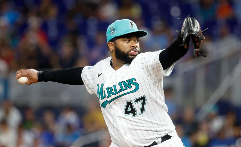 Sep 15, 2023; Miami, Florida, USA; Miami Marlins starting pitcher Johnny Cueto (47) pitches against the Atlanta Braves during the first inning at loan Depot Park. Mandatory Credit: Rhona Wise-USA TODAY Sports