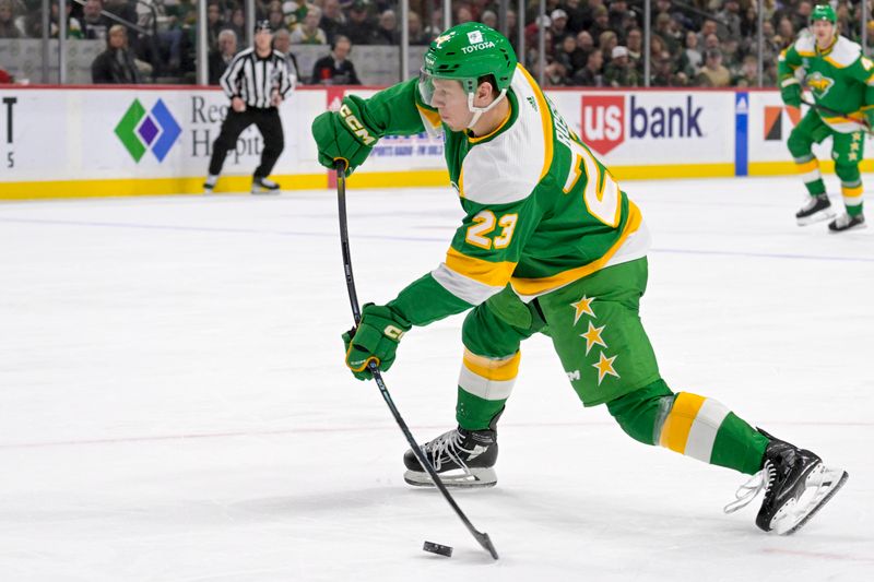 Feb 17, 2024; Saint Paul, Minnesota, USA;  Minnesota Wild forward Marco Rossi (23) takes a shot on goal against the Buffalo Sabres during the second period at Xcel Energy Center. Mandatory Credit: Nick Wosika-USA TODAY Sports