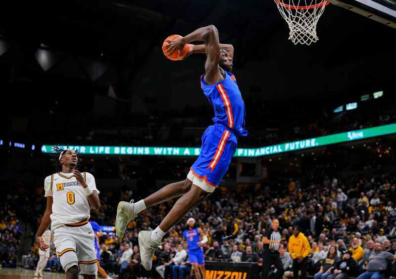 Jan 3, 2026; Columbia, Missouri, USA; Florida Gators center Rueben Chinyelu (9) dunks the ball during the second half against the Missouri Tigers at Mizzou Arena. Mandatory Credit: Jay Biggerstaff-Imagn Images