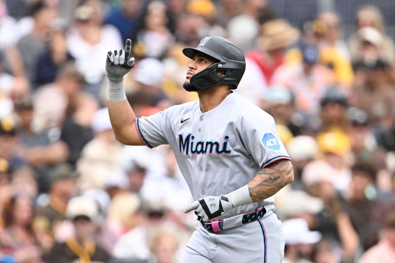 May 28, 2025; San Diego, California, USA; Miami Marlins catcher Agustin Ramirez (50) points skyward after hitting a solo home run during the third inning against the San Diego Padres at Petco Park. Mandatory Credit: Denis Poroy-Imagn Images