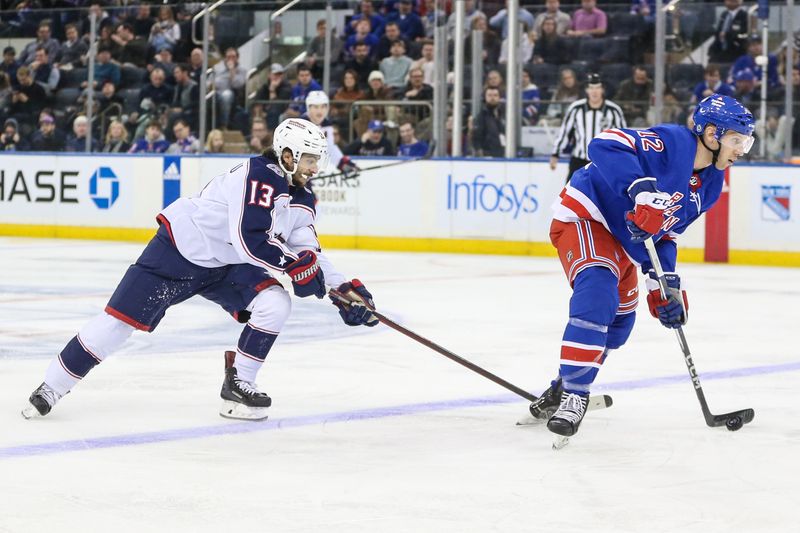 Nov 12, 2023; New York, New York, USA; Columbus Blue Jackets left wing Johnny Gaudreau (13) and New York Rangers center Nick Bonino (12) chase the puck in the second period at Madison Square Garden. Mandatory Credit: Wendell Cruz-USA TODAY Sports