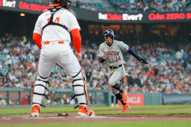 Jun 11, 2024; San Francisco, California, USA; Houston Astros outfielder Mauricio Dubón (14) scores a run during the second inning against the San Francisco Giants at Oracle Park. Mandatory Credit: Sergio Estrada-USA TODAY Sports