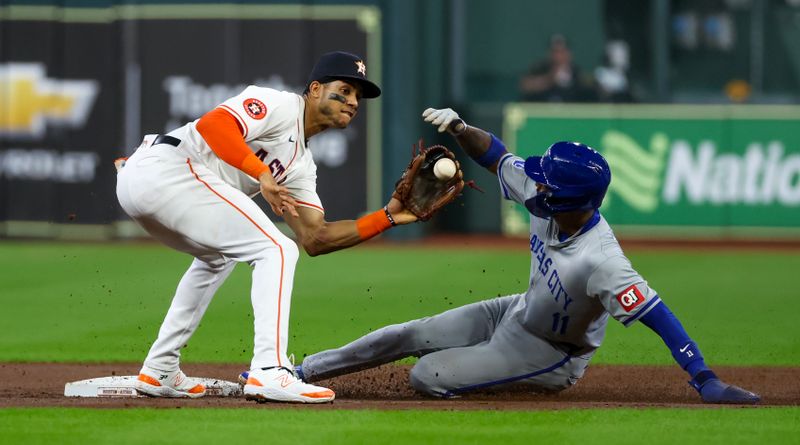 Aug 29, 2024; Houston, Texas, USA; Kansas City Royals third baseman Maikel Garcia (11) steals second base against Houston Astros shortstop Jeremy Pena (3) in the second inning at Minute Maid Park. Mandatory Credit: Thomas Shea-USA TODAY Sports