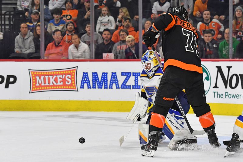 Mar 4, 2024; Philadelphia, Pennsylvania, USA; St. Louis Blues goaltender Jordan Binnington (50) makes a save as f72 looks for the rebound during the overtime period at Wells Fargo Center. Mandatory Credit: Eric Hartline-USA TODAY Sports