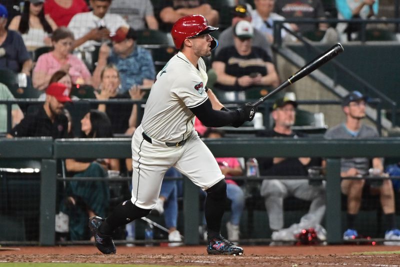 Apr 17, 2024; Phoenix, Arizona, USA;  Arizona Diamondbacks outfielder Randal Grichuk (15) doubles in the sixth inning against the Chicago Cubs at Chase Field. Mandatory Credit: Matt Kartozian-USA TODAY Sports