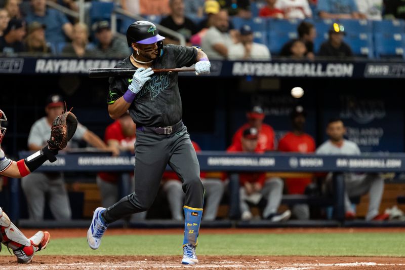 Jun 29, 2024; St. Petersburg, Florida, USA; Tampa Bay Rays outfielder Jose Siri (22) backs away from a bunt against the Washington Nationals during the seventh inning at Tropicana Field. Mandatory Credit: Matt Pendleton-USA TODAY Sports