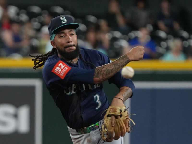 Jun 9, 2025; Phoenix, Arizona, USA; Seattle Mariners shortstop J.P. Crawford (3) turns the double play against the Arizona Diamondbacks in the fourth inning at Chase Field. Mandatory Credit: Rick Scuteri-Imagn Images