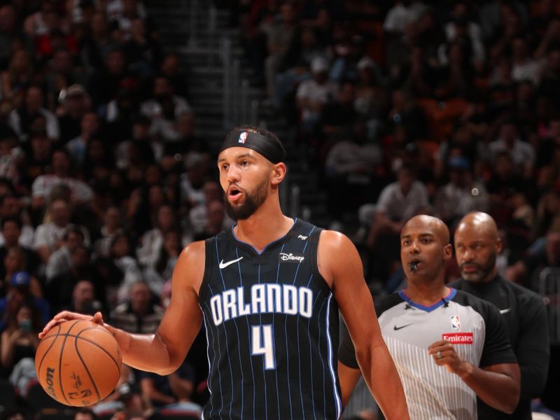 MIAMI, FL - OCTOBER 23: Jalen Suggs #4 of the Orlando Magic dribbles the ball during the game against the Miami Heat on October 23, 2024 at Kaseya Center in Miami, Florida. NOTE TO USER: User expressly acknowledges and agrees that, by downloading and or using this Photograph, user is consenting to the terms and conditions of the Getty Images License Agreement. Mandatory Copyright Notice: Copyright 2024 NBAE (Photo by Issac Baldizon/NBAE via Getty Images)