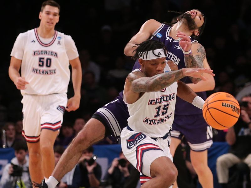 March 22, 2024, Brooklyn, NY, USA; Florida Atlantic Owls guard Alijah Martin (15) and Northwestern Wildcats guard Boo Buie (0) collide while chasing a loose ball in the first round of the 2024 NCAA Tournament at the Barclays Center. Mandatory Credit: Brad Penner-USA TODAY Sports