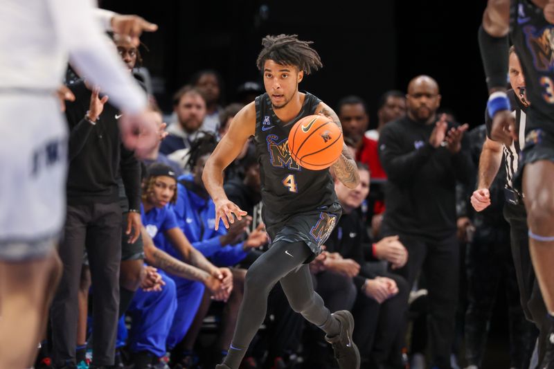 Feb 26, 2025; Memphis, Tennessee, USA; Memphis Tigers guard PJ Haggerty (4) drives with the ball against the Rice Owls during the first half at FedExForum. Mandatory Credit: Wesley Hale-Imagn Images