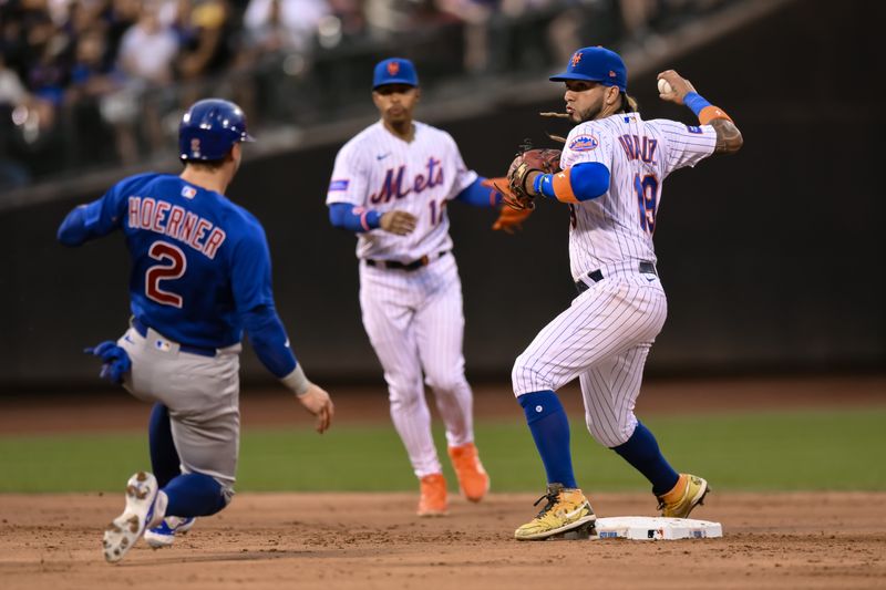 Aug 9, 2023; New York City, New York, USA; New York Mets second baseman Jonathan Arauz (19) gets a force out at second base on Chicago Cubs second baseman Nico Hoerner (2) and throws to first to complete a double play against the Chicago Cubs at Citi Field. Mandatory Credit: John Jones-USA TODAY Sports