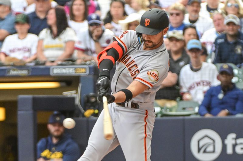 May 27, 2023; Milwaukee, Wisconsin, USA; San Francisco Giants right fielder Michael Conforto (8) hits a sacrifice fly in the first inning against the Milwaukee Brewers at American Family Field. Mandatory Credit: Benny Sieu-USA TODAY Sports