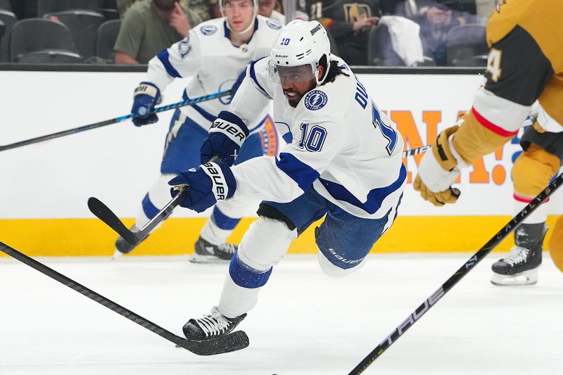 Mar 19, 2024; Las Vegas, Nevada, USA; Tampa Bay Lightning left wing Anthony Duclair (10) shoots against the Vegas Golden Knights during the first period at T-Mobile Arena. Mandatory Credit: Stephen R. Sylvanie-USA TODAY Sports