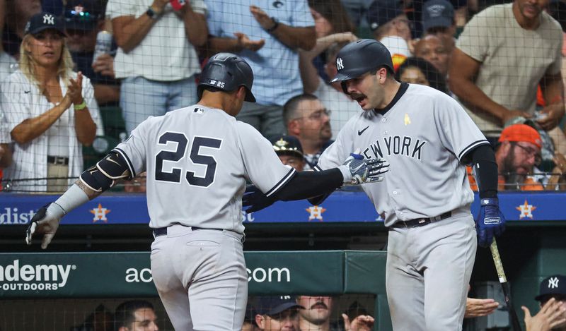 Sep 3, 2023; Houston, Texas, USA; New York Yankees second baseman Gleyber Torres (25) celebrates with catcher Austin Wells (88) after hitting a home run during the ninth inning against the Houston Astros at Minute Maid Park. Mandatory Credit: Troy Taormina-USA TODAY Sports