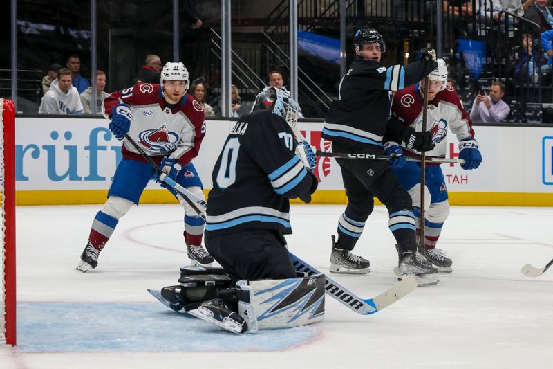Oct 24, 2024; Salt Lake City, Utah, USA; Colorado Avalanche defenseman Sam Malinski (70) saves a shot by the Colorado Avalanche during the first period at Delta Center. Mandatory Credit: Rob Gray-Imagn Images