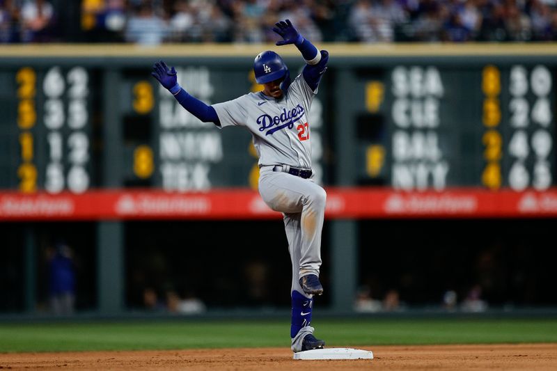 Jun 18, 2024; Denver, Colorado, USA; Los Angeles Dodgers left fielder Miguel Vargas (27) reacts after hitting an RBI double in the seventh inning against the Colorado Rockies at Coors Field. Mandatory Credit: Isaiah J. Downing-USA TODAY Sports