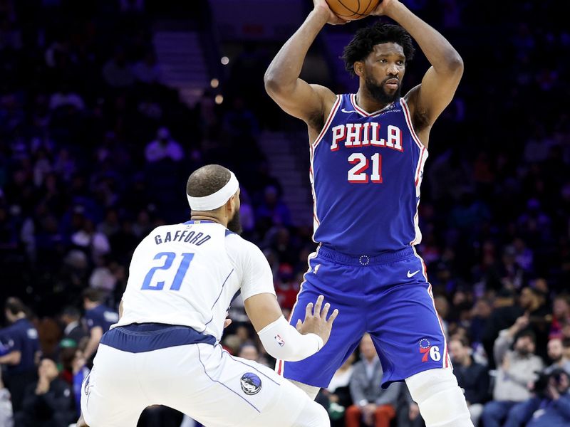 PHILADELPHIA, PENNSYLVANIA - FEBRUARY 04: Joel Embiid #21 of the Philadelphia 76ers looks to pass against Daniel Gafford #21 of the Dallas Mavericks during the first half of the game at the Wells Fargo Center on February 04, 2025 in Philadelphia, Pennsylvania. NOTE TO USER: User expressly acknowledges and agrees that, by downloading and or using this photograph, User is consenting to the terms and conditions of the Getty Images License Agreement. (Photo by Emilee Chinn/Getty Images)