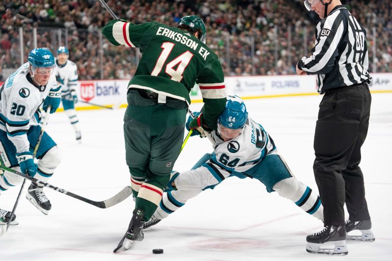 Mar 3, 2024; Saint Paul, Minnesota, USA; San Jose Sharks center Mikael Granlund (64) and Minnesota Wild center Joel Eriksson Ek (14) face off in the third period at Xcel Energy Center. Mandatory Credit: Matt Blewett-USA TODAY Sports