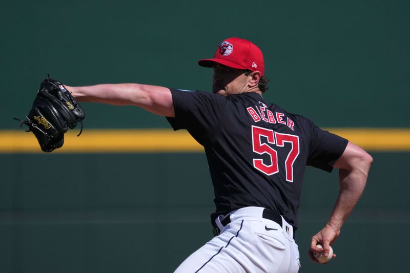 Mar 2, 2024; Goodyear, Arizona, USA; Cleveland Guardians starting pitcher Shane Bieber (57) pitches against the Kansas City Royals during the first inning at Goodyear Ballpark. Mandatory Credit: Joe Camporeale-USA TODAY Sports