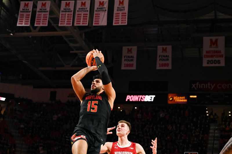 Jan 25, 2023; College Park, Maryland, USA;  Maryland Terrapins forward Patrick Emilien (15) shoots a jump shot as Wisconsin Badgers forward Tyler Wahl (5) looks on during the second half at Xfinity Center. Mandatory Credit: Tommy Gilligan-USA TODAY Sports