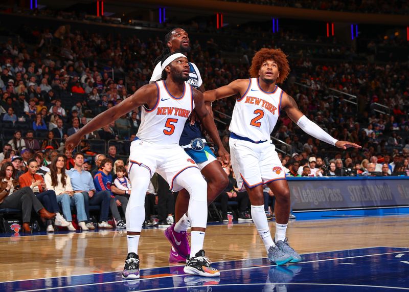 NEW YORK, NY - OCTOBER 13: Precious Achiuwa #5 and Miles McBride #2 of the New York Knicks box out Naz Reid #11 of the Minnesota Timberwolves on October 13, 2024 at Madison Square Garden in New York City, New York.  NOTE TO USER: User expressly acknowledges and agrees that, by downloading and or using this photograph, User is consenting to the terms and conditions of the Getty Images License Agreement. Mandatory Copyright Notice: Copyright 2024 NBAE  (Photo by David L. Nemec/NBAE via Getty Images)