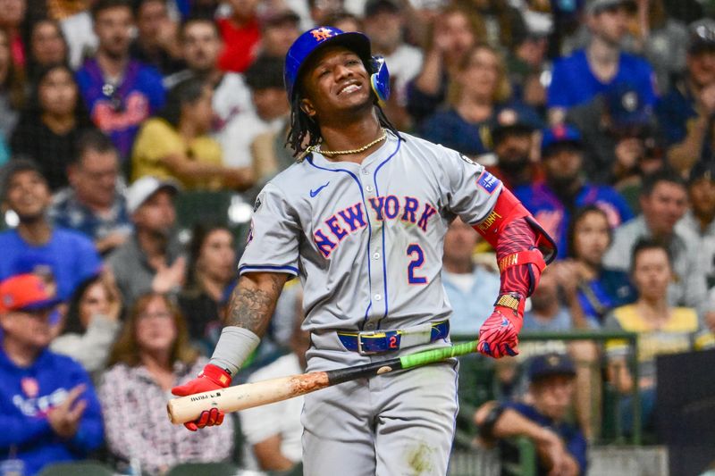 Sep 28, 2024; Milwaukee, Wisconsin, USA; New York Mets shortstop Luisangel Acuna (2) reacts after striking out in the third inning against the Milwaukee Brewers at American Family Field. Mandatory Credit: Benny Sieu-Imagn Images