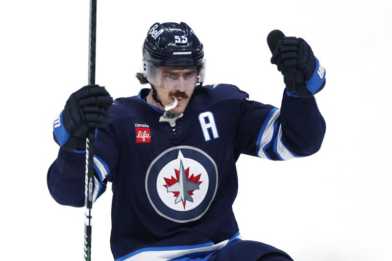 Dec 27, 2025; Winnipeg, Manitoba, CAN; Winnipeg Jets center Mark Scheifele (55) celebrates a goal against the Minnesota Wild in the second period at Canada Life Centre. Mandatory Credit: James Carey Lauder-Imagn Images