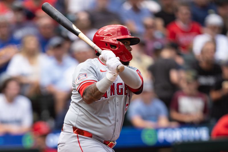 Jul 24, 2024; Seattle, Washington, USA;  Los Angeles Angels designated hitter Willie Calhoun (5) hits anRBI-single during the eighth inning at T-Mobile Park. Mandatory Credit: Stephen Brashear-USA TODAY Sports