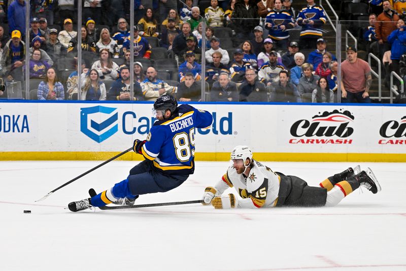 Mar 25, 2024; St. Louis, Missouri, USA;  St. Louis Blues left wing Pavel Buchnevich (89) is tripped by Vegas Golden Knights defenseman Noah Hanifin (15) resulting in a penalty shot in overtime at Enterprise Center. Mandatory Credit: Jeff Curry-USA TODAY Sports