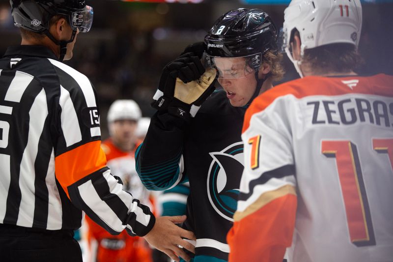 Oct 12, 2024; San Jose, California, USA; San Jose Sharks center Will Smith (2) wipes his face after getting in a fight with Anaheim Ducks center Trevor Zebras (11) during the second period at SAP Center at San Jose. Mandatory Credit: D. Ross Cameron-Imagn Images