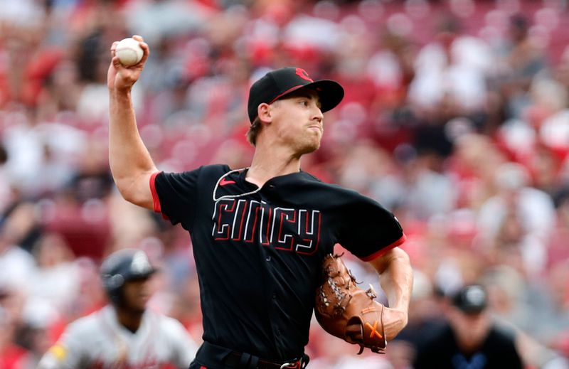 Jun 23, 2023; Cincinnati, Ohio, USA; Cincinnati Reds starting pitcher Luke Weaver (34) delivers a pitch against the Atlanta Braves during the first inning at Great American Ball Park. Mandatory Credit: David Kohl-USA TODAY Sports