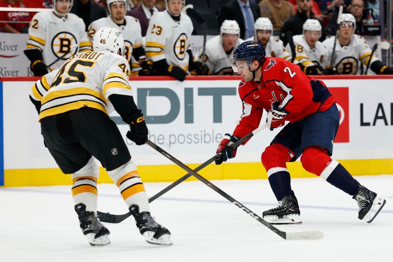 Oct 2, 2025; Washington, District of Columbia, USA; Washington Capitals defenseman Vincent Iorio (2) skates with the puck as Boston Bruins defenseman Jonathan Aspirot (45) defends in the third period at Capital One Arena. Mandatory Credit: Geoff Burke-Imagn Images