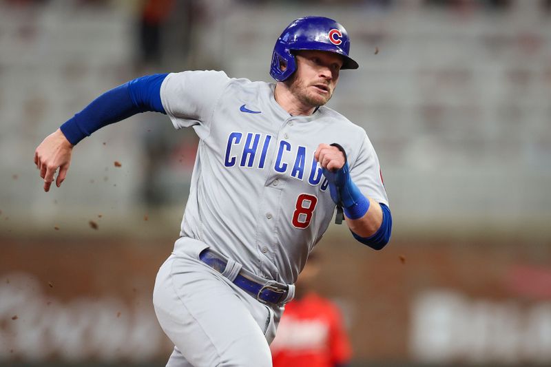 Sep 28, 2023; Atlanta, Georgia, USA; Chicago Cubs left fielder Ian Happ (8) runs home to score against the Atlanta Braves in the sixth inning at Truist Park. Mandatory Credit: Brett Davis-USA TODAY Sports