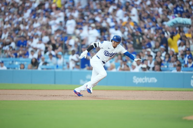 Aug 8, 2025; Los Angeles, California, USA; Los Angeles Dodgers designated hitter Shohei Ohtani (17) runs back to first during the first inning against the Toronto Blue Jays at Dodger Stadium. Mandatory Credit: Kirby Lee-Imagn Images