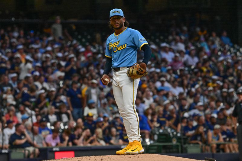 Jul 26, 2024; Milwaukee, Wisconsin, USA; Milwaukee Brewers starting pitcher Freddy Peralta (51) waits to throw a pitch in the fourth inning against the Miami Marlins at American Family Field. Mandatory Credit: Benny Sieu-USA TODAY Sports