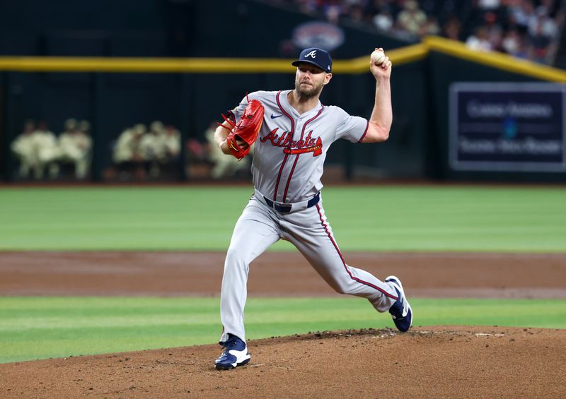 Jul 9, 2024; Phoenix, Arizona, USA; Atlanta Braves pitcher Chris Sale throws in the first inning against the Arizona Diamondbacks at Chase Field. Mandatory Credit: Mark J. Rebilas-USA TODAY Sports