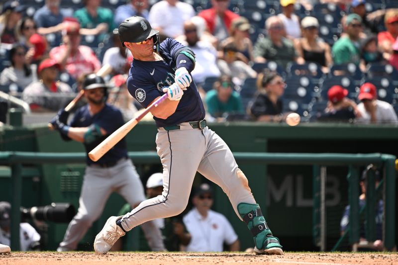 May 26, 2024; Washington, District of Columbia, USA; Seattle Mariners first baseman Ty France (23) hits the ball into pay against the Washington Nationals during the sixth inning at Nationals Park. Mandatory Credit: Rafael Suanes-USA TODAY Sports
