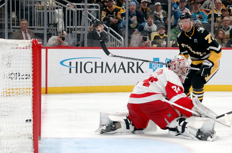 Apr 11, 2024; Pittsburgh, Pennsylvania, USA; Pittsburgh Penguins center Jeff Carter (77) scores a short-handed goal against Detroit Red Wings goaltender Alex Lyon (34) during the third period at PPG Paints Arena. Pittsburgh won 6-5 in overtime. Mandatory Credit: Charles LeClaire-USA TODAY Sports