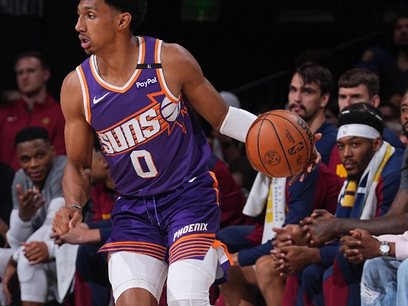 DENVER, CO - OCTOBER 13: Ryan Dunn #0 of the Phoenix Suns dribbles the ball during the game against the Denver Nuggets on October 13, 2024 at Ball Arena in Denver, Colorado. NOTE TO USER: User expressly acknowledges and agrees that, by downloading and/or using this Photograph, user is consenting to the terms and conditions of the Getty Images License Agreement. Mandatory Copyright Notice: Copyright 2024 NBAE (Photo by Bart Young/NBAE via Getty Images)